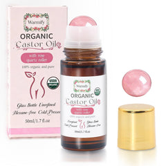 Warmify organic castor oil bottle with rose quartz roller for full-body hydration.