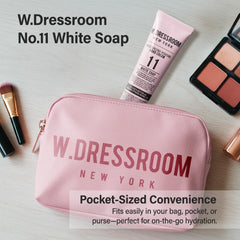 W.Dressroom Hand Cream on desk with bag, ideal for all-day carry.