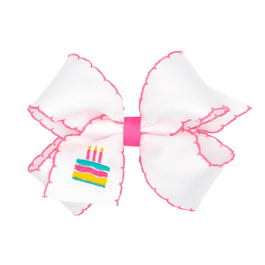 Wee Ones grosgrain bow with Moonstitch cake stitch for birthday celebrations.