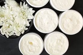 Windrift Hill body butter with goat's milk formula close-up highlighting nourishing ingredients.
