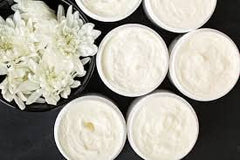 Windrift Hill body butter with goat's milk formula close-up highlighting nourishing ingredients.