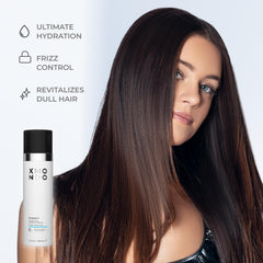 XMONDO Hydrify applied on damp hair smoothing mid-lengths to ends.