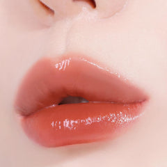 Slanted applicator edge follows lip contours for even coverage.