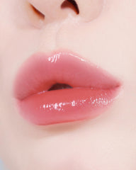 Custom slanted applicator contours lips for precise glow.