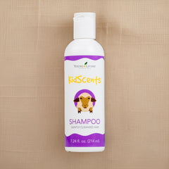 Young Living KidScents Shampoo with water droplets signals hydration and freshness.