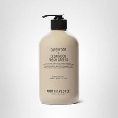 Applying Youth To The People hand and body lotion on hands shows smooth, balanced moisture.