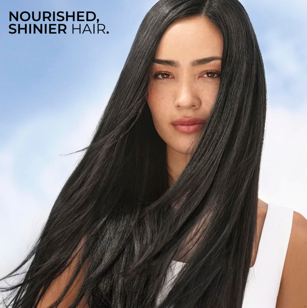Yves Rocher Raspberry Shine Hair Vinegar liquid glistens, suggesting buildup-free, light hair