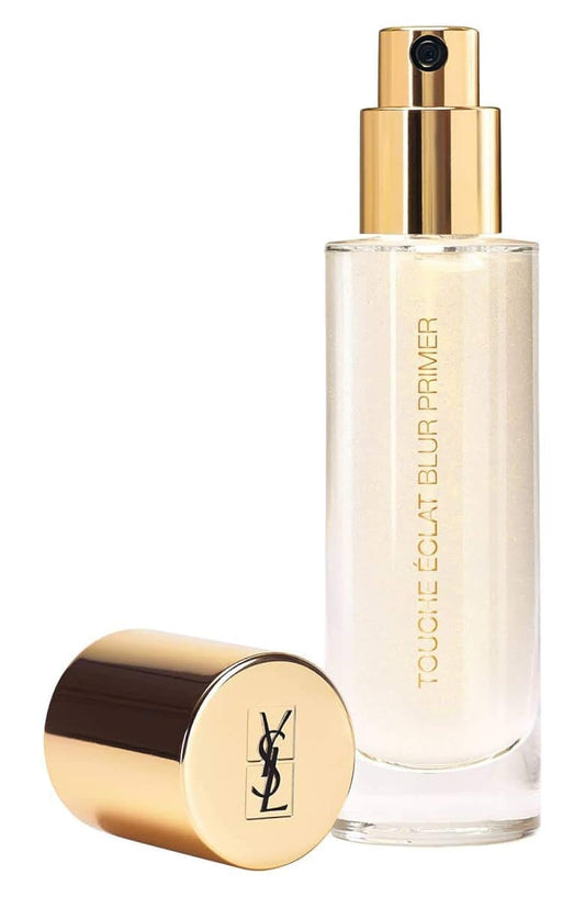 Yves Saint Laurent Blur Primer Silver bottle adds subtle radiance and smooths skin for foundation prep.