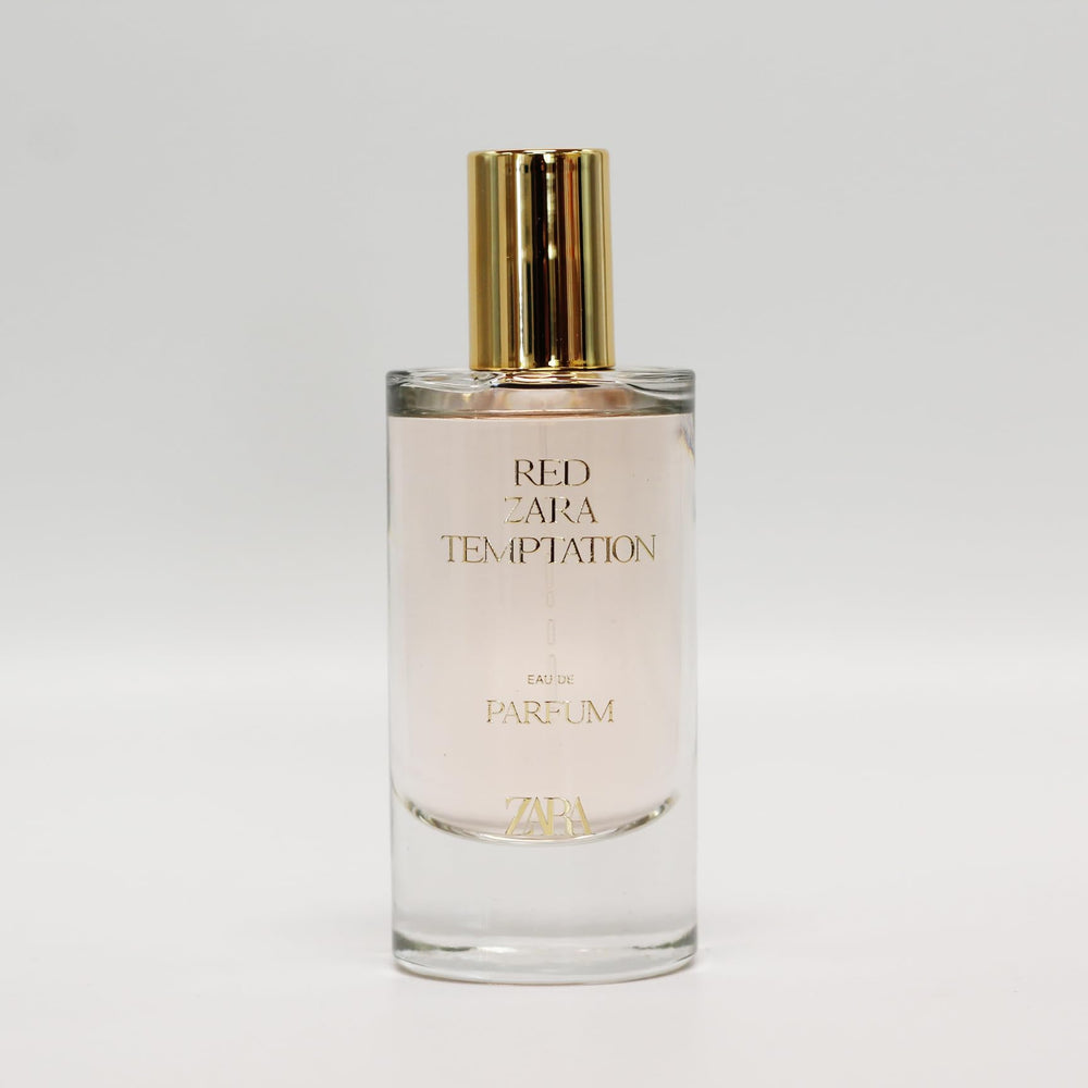 Zara Red Temptation bottle being poured highlights a vibrant, long-lasting aroma for evening events.
