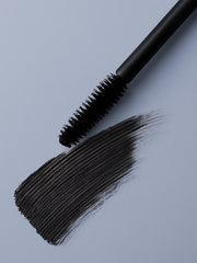 Zuzu Luxe Luxe Mascara Onyx brush demonstrates lengthening, clump-free design for defined lashes.