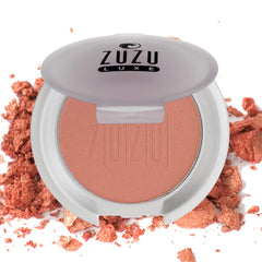 Zuzu Luxe Mineral Blush Samba compact close-up with warm bronze shimmer.