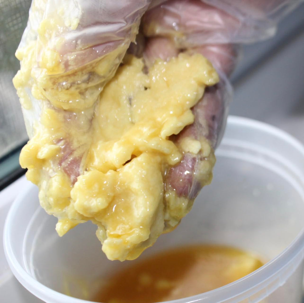 3CAYG Cocoa Butter melt-in-hand texture warming on skin.