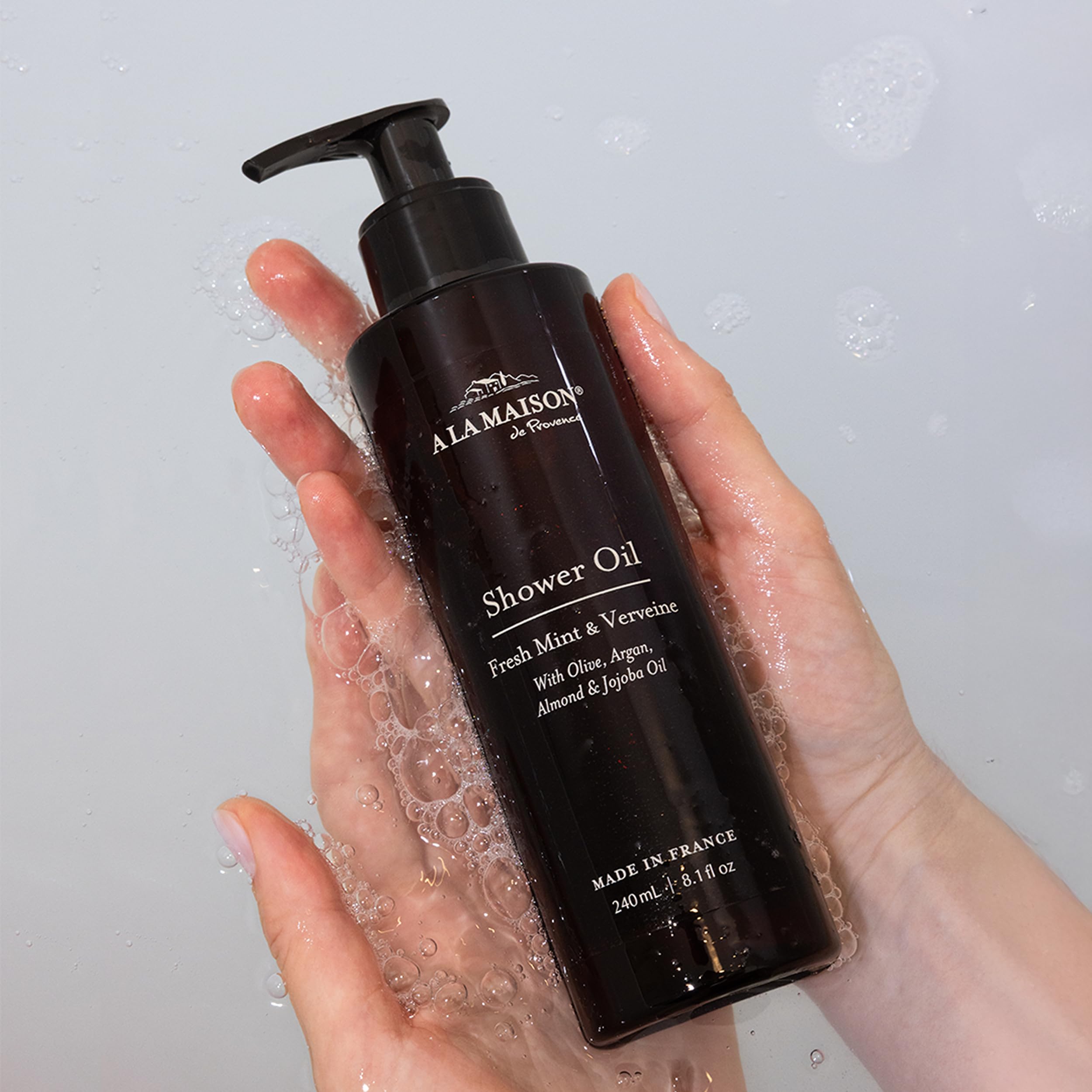 A LA MAISON Jasmine & Santal lather swirls on skin for gentle cleansing.