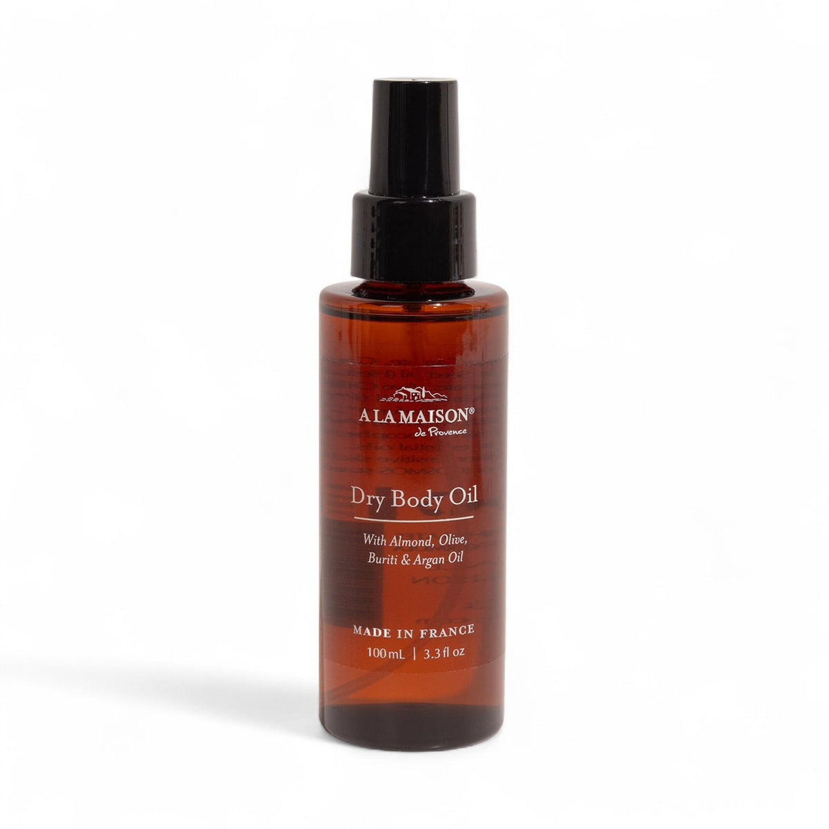 A LA MAISON Dry Body Oil Spray bottle pour with argan oil for lightweight hydration.