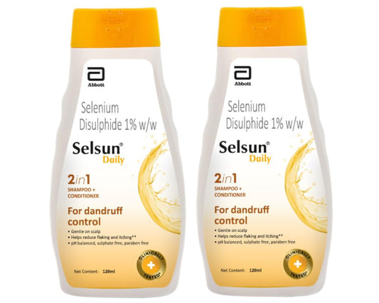 Abbott Selsun Daily shampoo bottle front promotes dandruff relief.