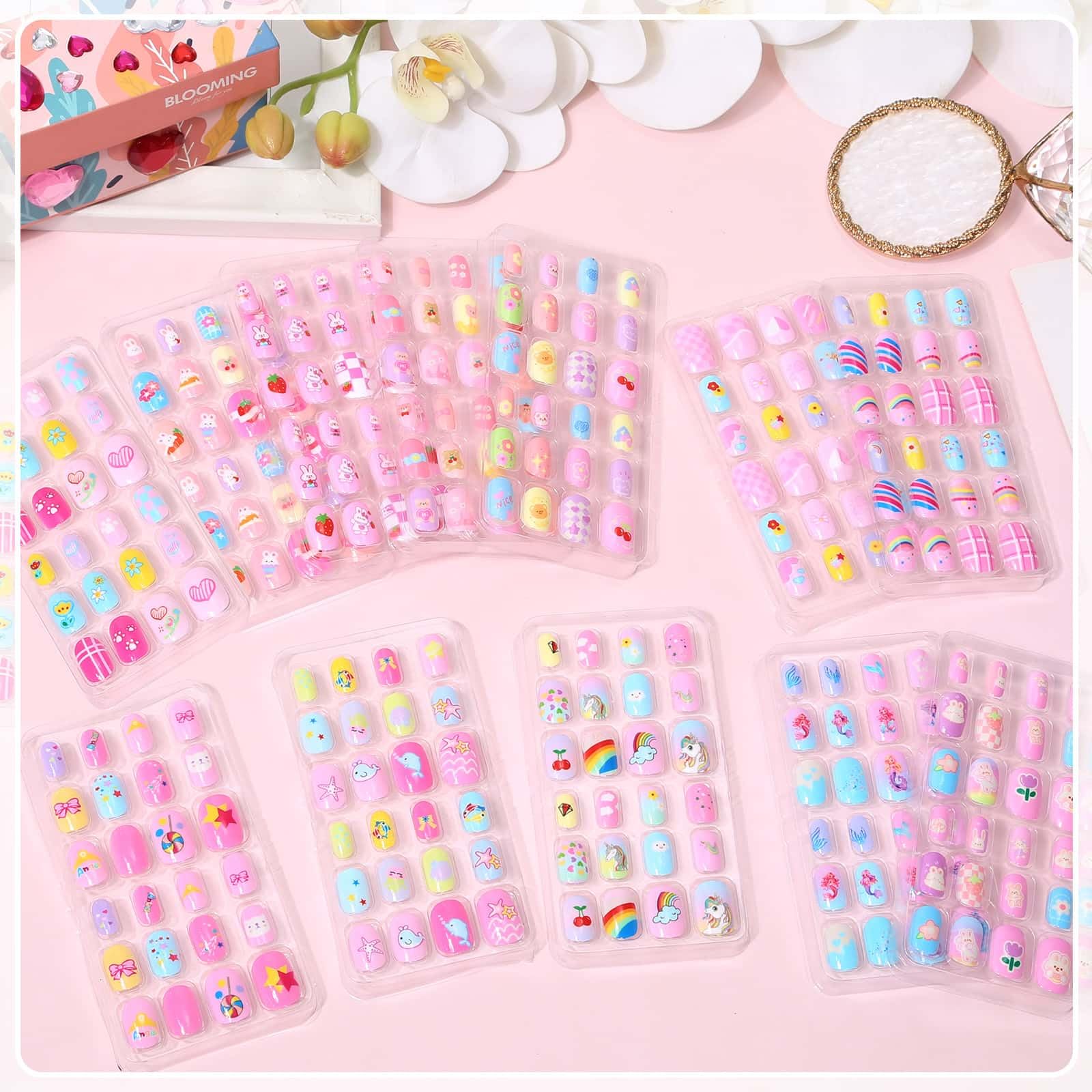 Acejoz 12 patterns press-on nails with colorful designs for creative kids' looks.