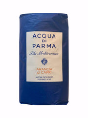 Three wrapped Acqua Di Parma Arancia Di Capri soaps on a tray for spa-like cleansing.