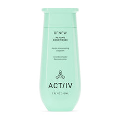 ACTIIV Renew Healing Conditioner bottle on bathroom shelf offers hydration for all hair types.