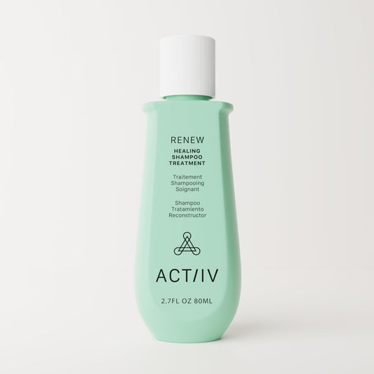 ACTIIV Renew shampoo label close-up, plant-based formula for damaged hair