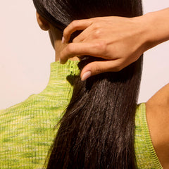 Acure Bonding Hair Mask application on damp hair shows easy use.