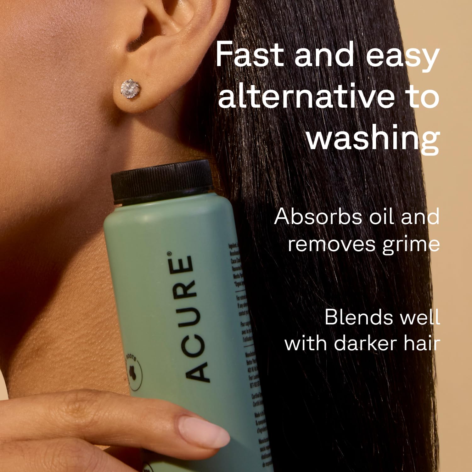 Acure travel-size dry shampoo bottle displays rosemary and cocoa formula for refreshed roots on the go.