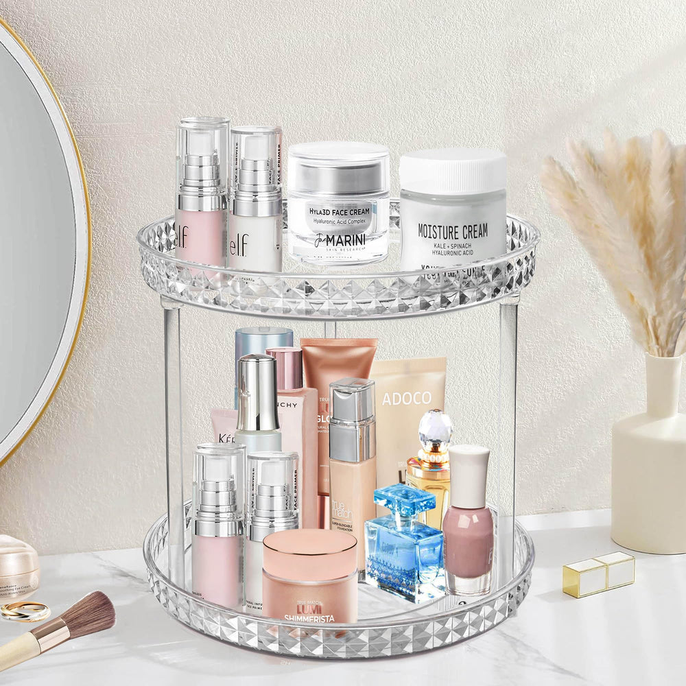 Adoco two-tier lazy Susan bathroom organizer on countertop for easy cosmetics access.