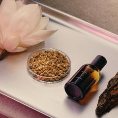 Aesop Aurner top notes of roman chamomile and pink pepper.