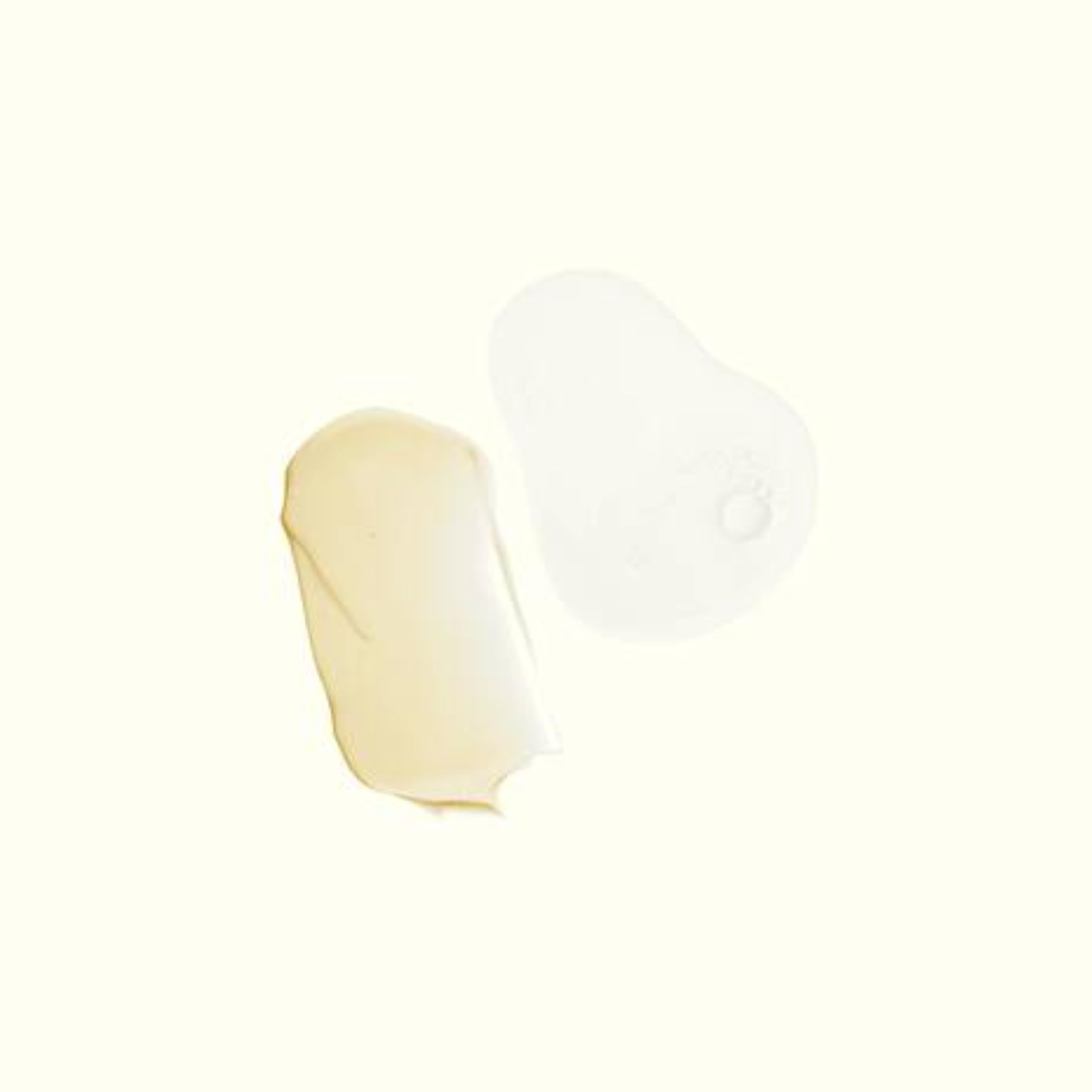 Duo of cleanser and balm arranged with citrus slices to suggest fragrance