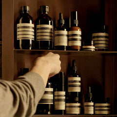 Close-up of cedar atlas, patchouli, clove bud ingredients in Eleos balm.