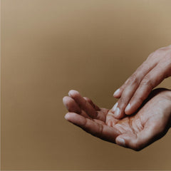 Aesop Reverence Aromatique Hand Balm with macadamia oil close-up signals nourishing care.
