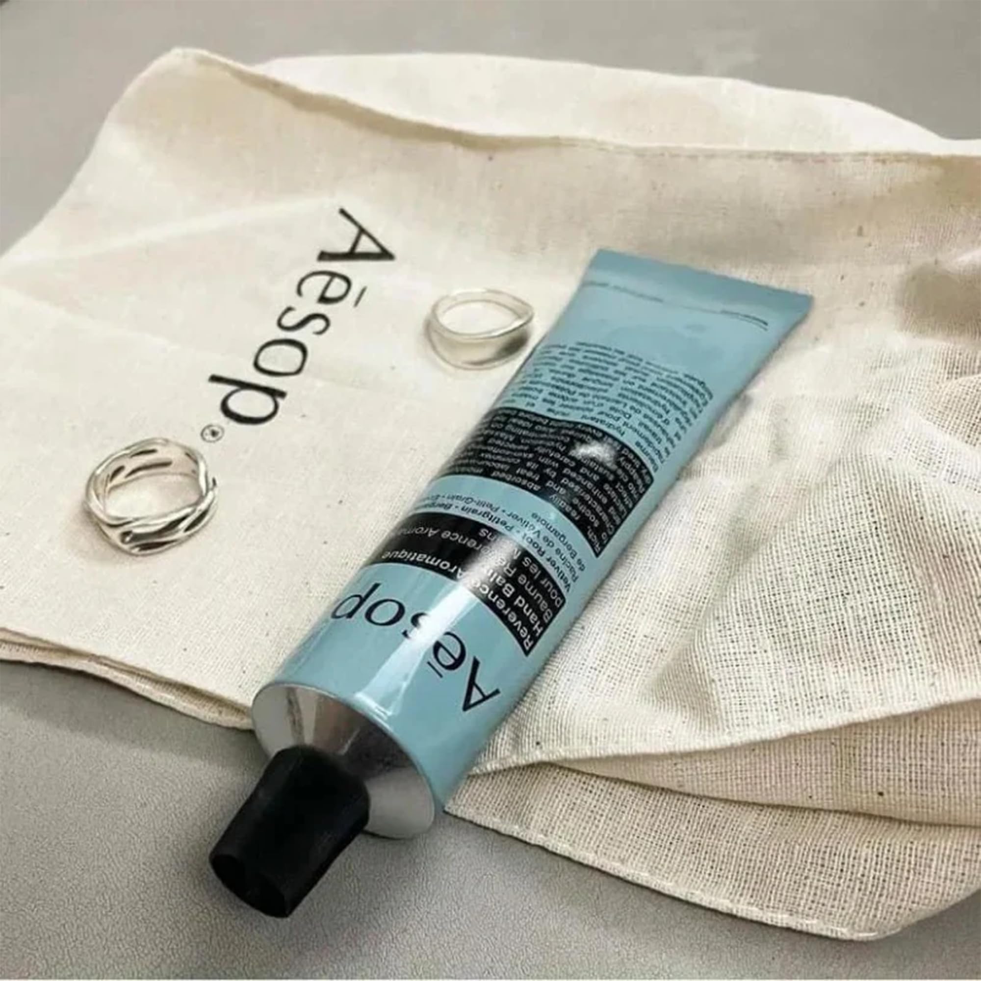Aesop Reverence Aromatique Hand Balm aroma close-up highlights woodsy, smoky notes.