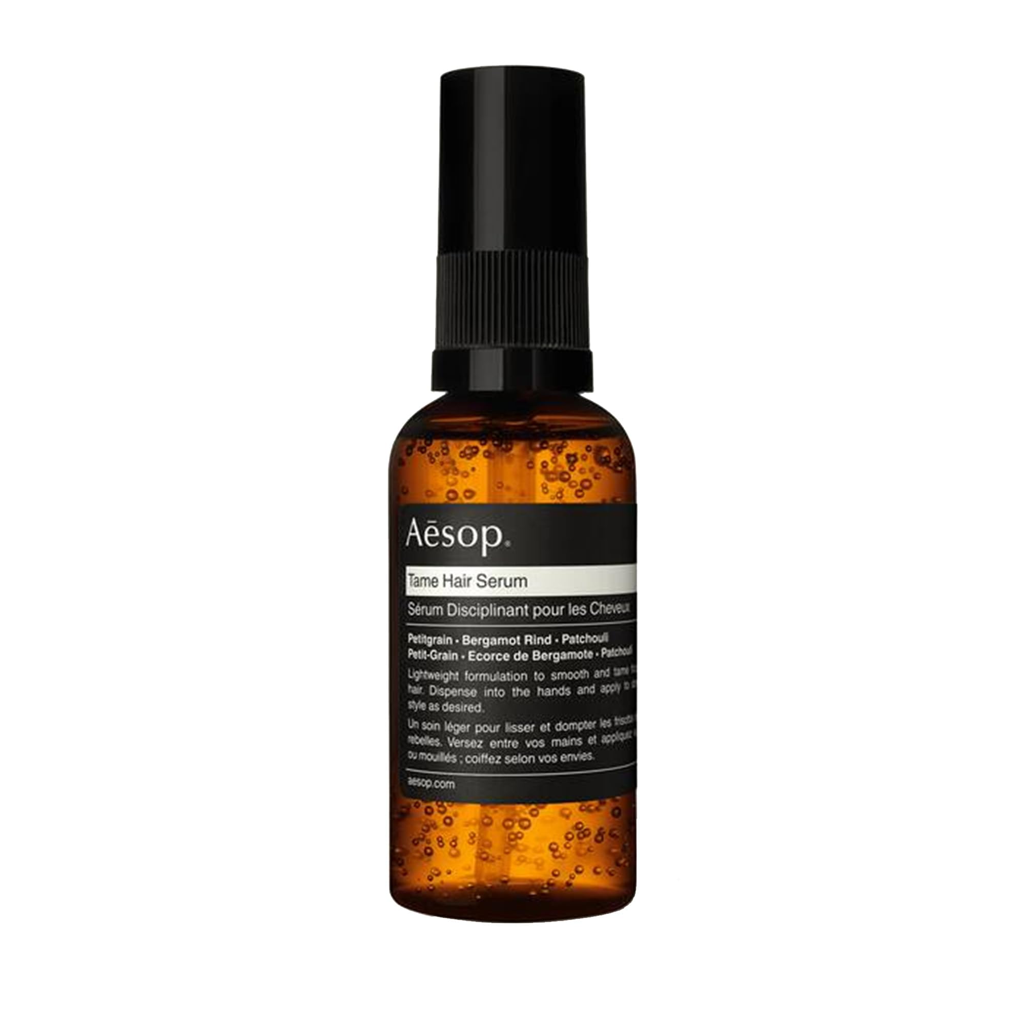 Aesop Tame Hair Serum bottle with pump for controlled smoothing.