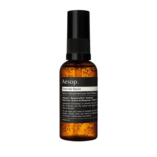 Aesop Tame Hair Serum bottle with pump for controlled smoothing.