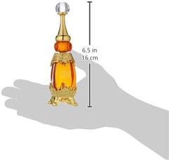 Orange gold flacon packaging of Afnan Adwaa Al Sharq on display