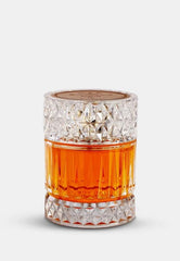Afnan Macarena Sharaf Blend bottle presented with warm spices for elegant evening wear.