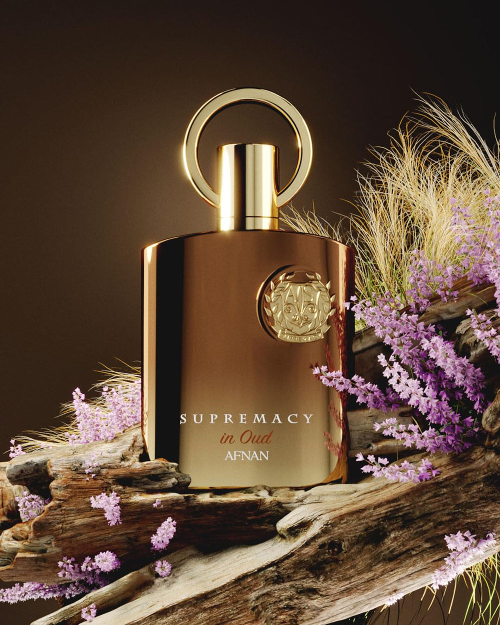 Afnan Supremacy in Oud wood tones display, evokes rich oud and spice.