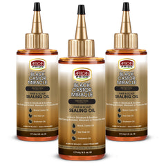 African Pride Black Castor Miracle Oil bottle for deep hydration and moisture sealing.