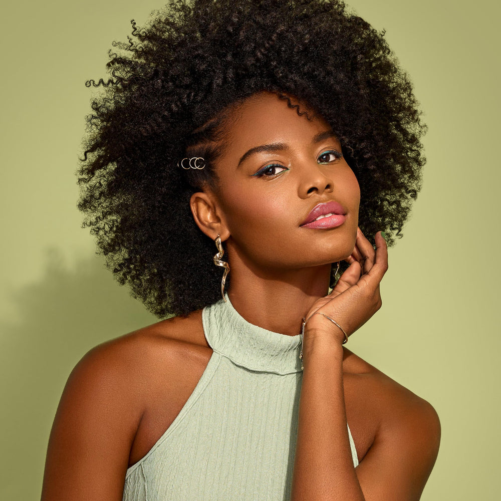 African Pride Feel It Formula under a dryer cap for enhanced deep conditioning.