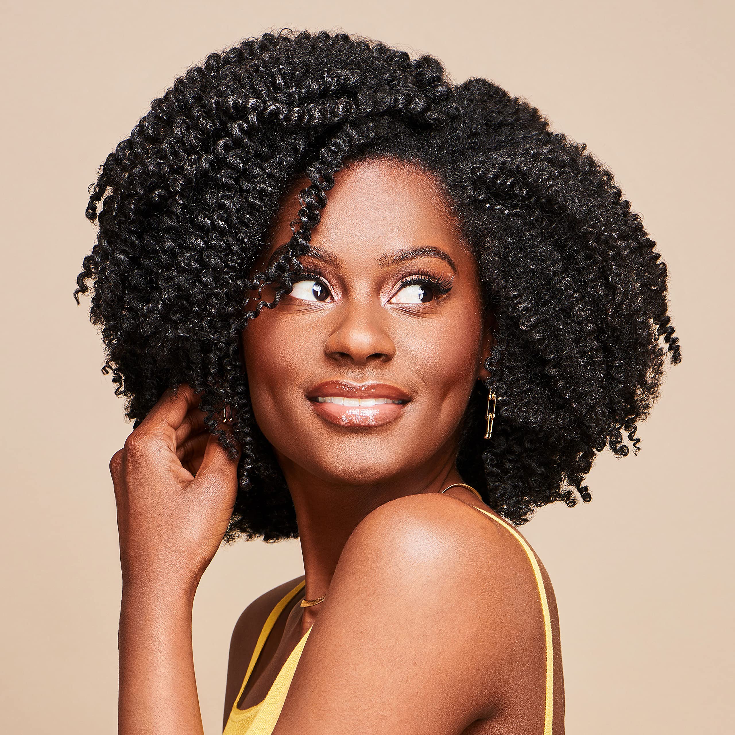 African Pride Moisture Miracle bottle close-up highlights premium natural ingredients