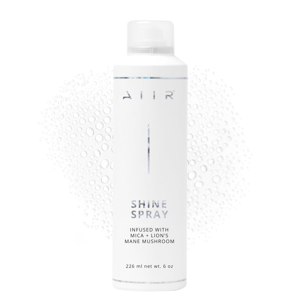 AIIR Shine Spray bottle closeup showing glossy finish and color enhancement.