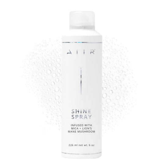 AIIR Shine Spray bottle closeup showing glossy finish and color enhancement.