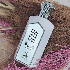 Al Absar Nasma perfume on display, elegant fragrance for day or night wear.