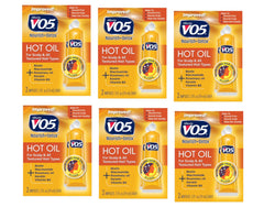 Alberto VO5 moisturizing hot oil tubes in hand for smooth, hydrated hair.