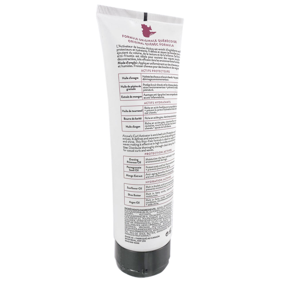 Damp hair being styled with Alcove Curl Activator for smooth definition