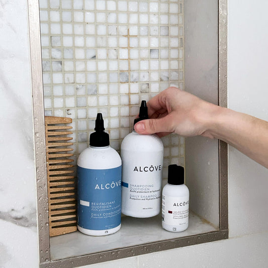 Alcôve Daily Conditioner bottle gloss promotes smooth, manageable strands.