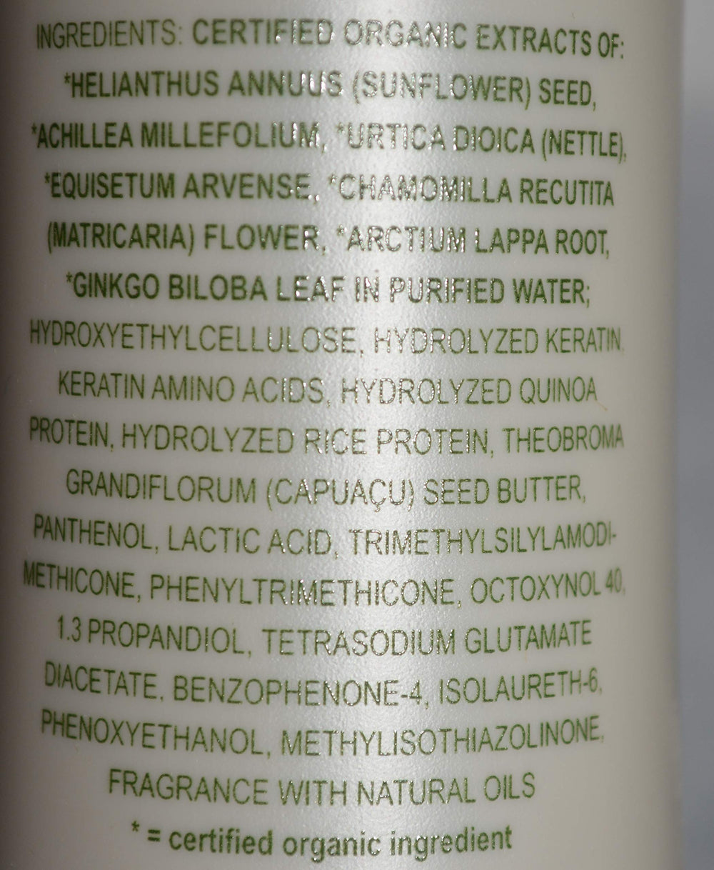 Applying All-Nutrient Straight+ smoothing cream for sleek, manageable hair.