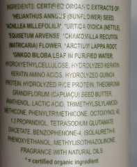 Applying All-Nutrient Straight+ smoothing cream for sleek, manageable hair.