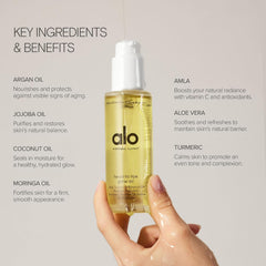 Applying ALO Head-to-Toe Glow Oil for a radiant glow.