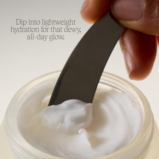Close-up of Alo Luminizing Face Moisturizer's silky cream absorbing into skin.