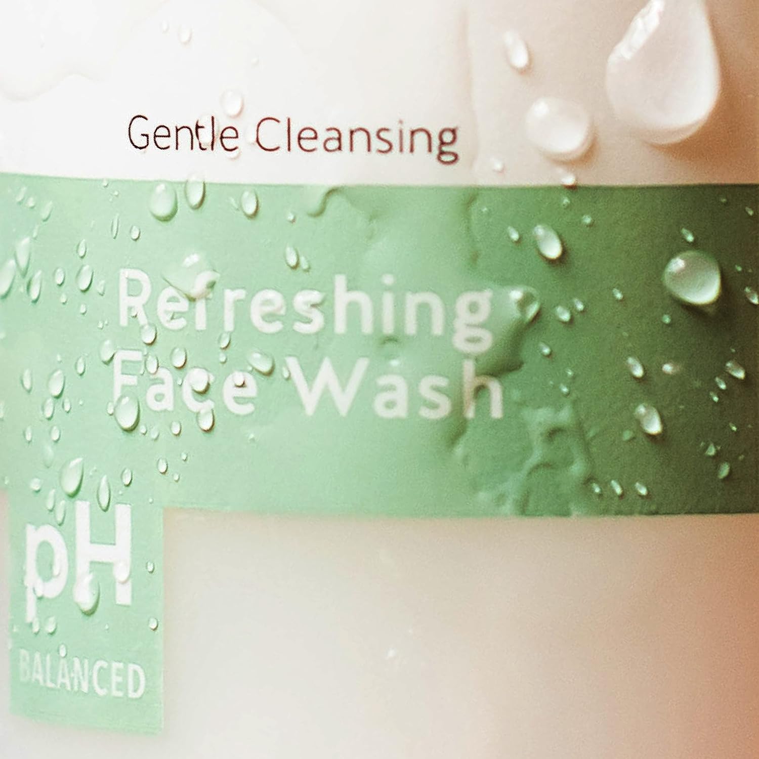 Running water demonstrates Alpha Skin Care Refreshing Face Wash rinsing clean for balanced skin.